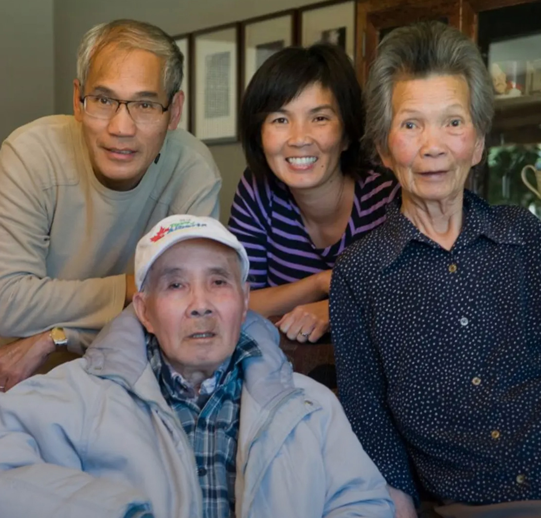 Pat with her parents and older brother.